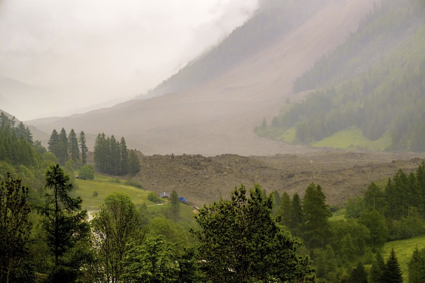 A large avalanche with a mixture of ice, rock, snow and water reach the valley floor is pictured in Wiler after the Birch glacier collapsing above Blatten, Switzerland, Wednesday, May 28, 2025. (Jean- ...