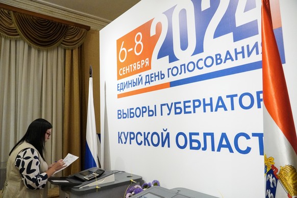 epa11593543 A member of a local electoral commission prepares for count ballots during the single election day, at a polling station in Kursk, Russia, 08 September 2024. Four candidates are running fo ...