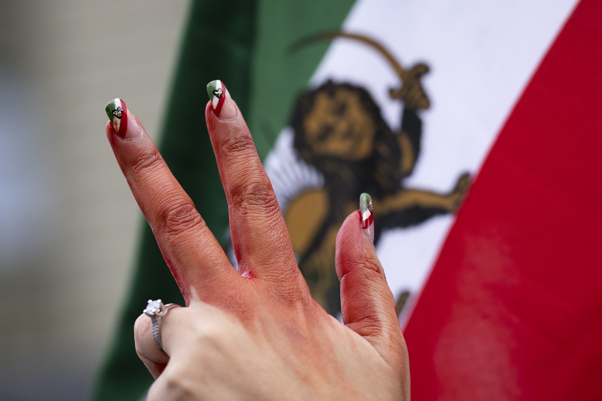 A woman's hand with red paint pictured during a freedom rally for Iranian Women, on the Federal Square (Bundesplatz) in Bern, Switzerland, on Saturday, November 5, 2022. After the death of Mahsa  ...