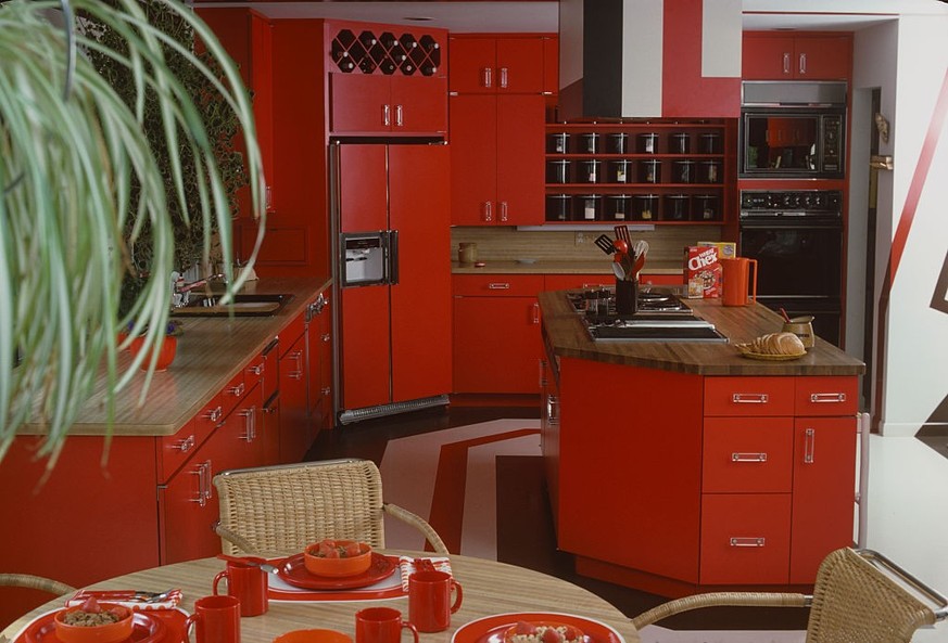 View of a showroom kitchen, where most of the fittings and fixtures are red, 1978. (Photo by Susan Wood/Getty Images)