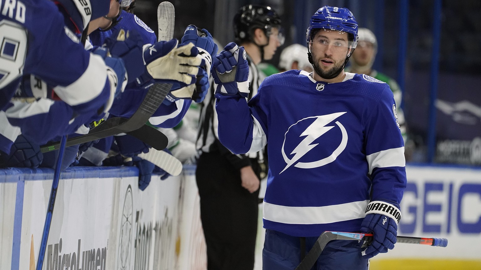 Tampa Bay Lightning center Tyler Johnson (9) celebrates with the bench after his goal against the Dallas Stars during the first period of an NHL hockey game Wednesday, May 5, 2021, in Tampa, Fla. (AP  ...