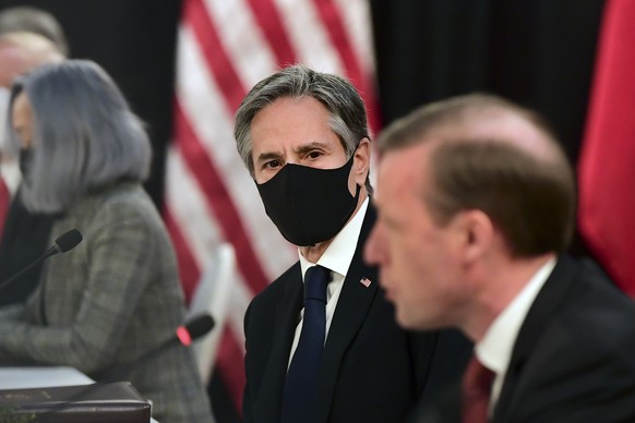 Secretary of State Antony Blinken, second from right, listens as national security adviser Jake Sullivan, right, speaks at the opening session of US-China talks at the Captain Cook Hotel in Anchorage, ...