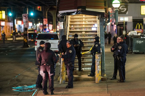 New York City Police officers gather following a shooting at the Mount Eden Avenue subway station, Monday, Feb. 12, 2024, in the Bronx borough of New York. (AP Photo/Eduardo Munoz Alvarez)