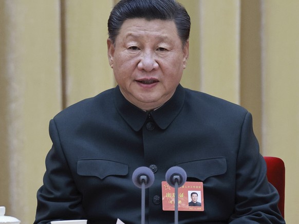 In this photo released by Xinhua News Agency, Chinese President Xi Jinping, also general secretary of the Communist Party of China Central Committee and chairman of the Central Military Commission (CM ...