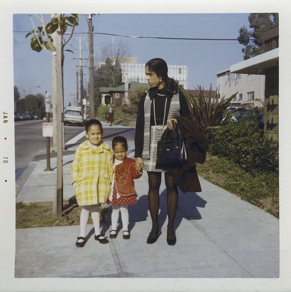 This January 1970 photo provided by the Kamala Harris campaign shows her, left, with her sister, Maya, and mother, Shyamala, outside their apartment in Berkeley, Calif., after her parents' separation. ...