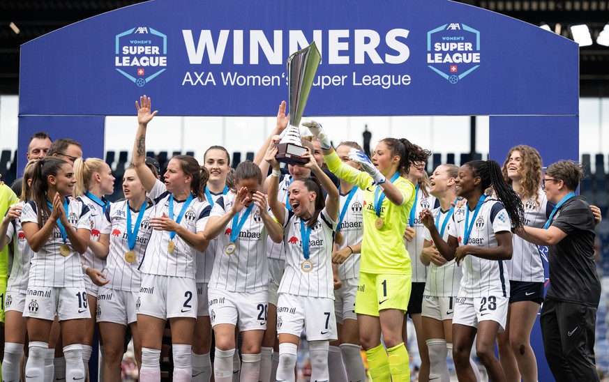 Zuerichs player celebrate with the trophy during the Women