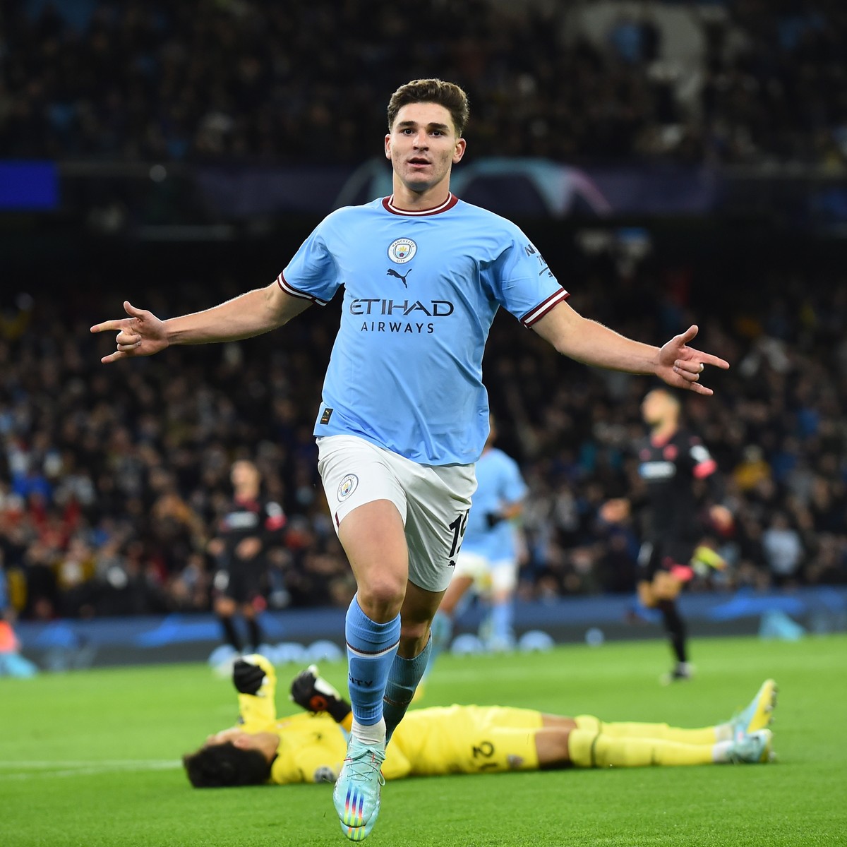 epa10282545 Manchester City's Julian Alvarez celebrates after scoring the 2-1 during the UEFA Champions League group G soccer match between Manchester City and Sevilla FC in Manchester, Britain,  ...