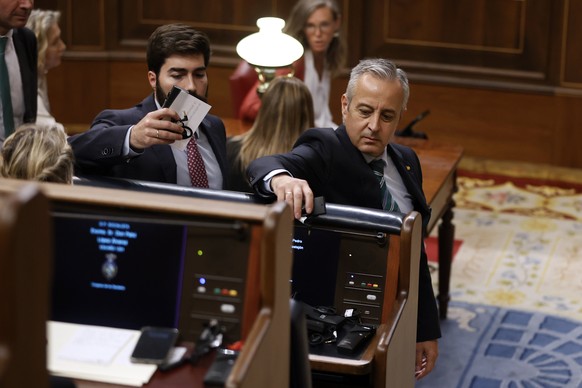 epa10869171 VOX MPs place their translation headset devices at the seat of Spain&#039;s acting Prime Minister Pedro Sanchez (not pictured) as they leave the Chamber in protest against the use of other ...