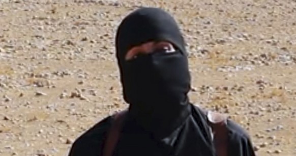 FILE - This undated image shows a frame from a video released Friday, Oct. 3, 2014, by Islamic State militants that purports to show the militant who beheaded of taxi driver Alan Henning . Mohammed Em ...
