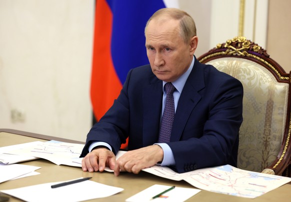 Russian President Vladimir Putin takes part in a ceremony to open new and reconstructed transport network sections in several regions via a videoconference at the Kremlin in Moscow, Russia, Thursday,  ...