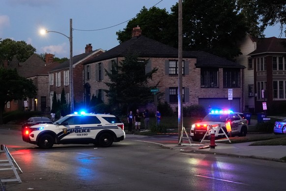 Police stand near where multiple people were shot at a community festival at the Agnes Reynolds Jackson Arboretum Saturday, June 6, 2026, in Toledo, Ohio. (AP Photo/Paul Sancya)
Ohio Shooting
