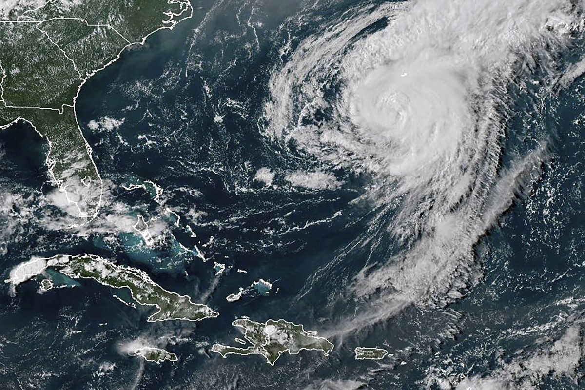 This GOES-16 GeoColor satellite image taken at 4:40 p.m EDT and provided by National Oceanic and Atmospheric Administration (NOAA) shows Hurricane Ernesto in the Atlantic Ocean south-southwest of Berm ...