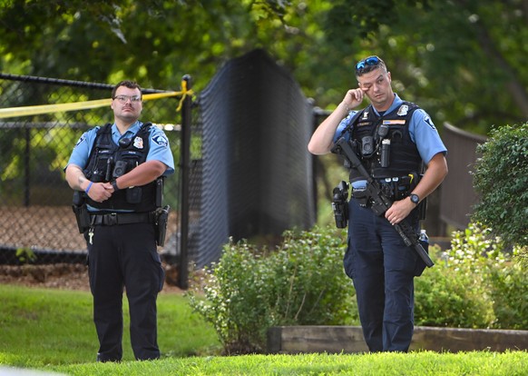 epa12327021 A police officer wipes his eye as he and other officers respond to a shooting at the Annunciation Catholic School in Minneapolis, Minnesota, USA, 27 August 2025. According to police, three ...