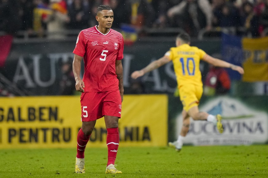 Switzerland&#039;s Manuel Akanji is dejected after the Euro 2024, group I, qualifying soccer match between Romania and Switzerland at the National Arena stadium in Bucharest, Romania, Tuesday, Nov. 21 ...
