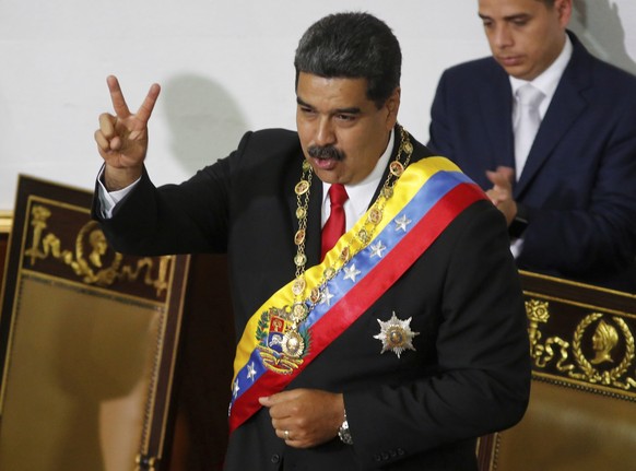Venezuela&#039;s President Nicolas Maduro gestures to members of the Constituent Assembly during a ceremony to recognize him as the winner of the presidential election in Caracas, Venezuela, Thursday, ...