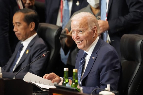 Sitting next to Indonesian President Joao Widodo, U.S. President Joe Biden smiles during the Partnership for Global Infrastructure and Investment meeting at the G20 summit, Tuesday, Nov. 15, 2022, in  ...