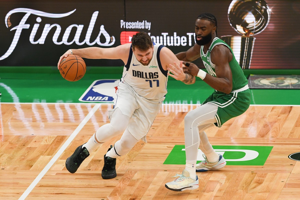 epa11419098 Dallas Mavericks guard Luka Doncic (L) drives by Boston Celtics guard Jaylen Brown (R) during the first half of the NBA Finals game five between the Dallas Mavericks and the Boston Celtics ...