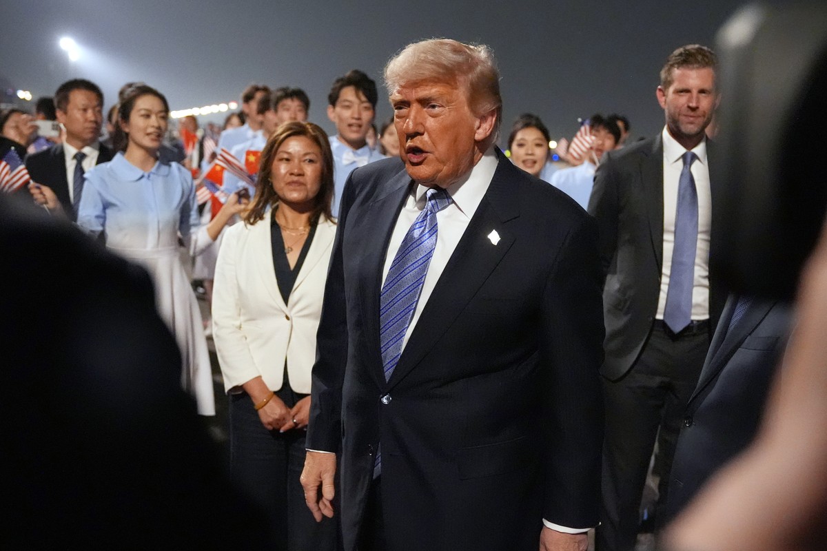 President Donald Trump walks during an arrival ceremony Wednesday, May 13, 2026, at Beijing Capital International Airport in Beijing, as Eric Trump watches at right.. (AP Photo/Mark Schiefelbein)
Dona ...