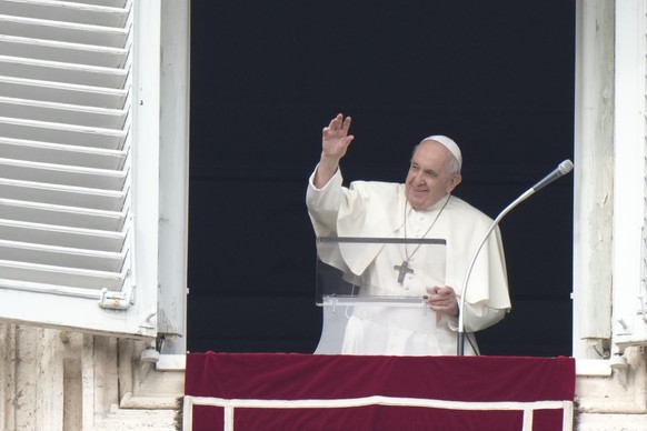 Pope Francis delivers his blessing as he recites the Angelus noon prayer from the window of his studio overlooking St.Peter&#039;s Square, at the Vatican, Sunday, Oct. 31, 2021. (AP Photo/Andrew Medic ...