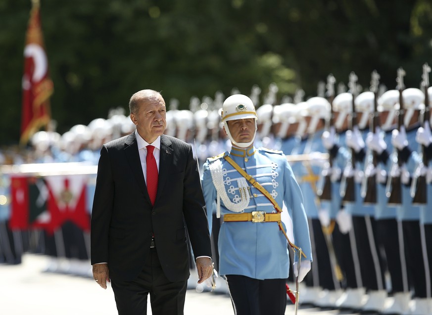 Turkey&#039;s President Recep Tayyip Erdogan inspects an honour guard as he arrives at the parliament in Ankara, Turkey to attend opening session of the new parliament in Ankara, Turkey, Saturday, Jul ...