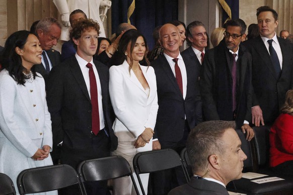 From left, Priscilla Chan, Meta CEO Mark Zuckerberg, Lauren Sanchez, Amazon founder Jeff Bezos, Google CEO Sundar Pichai and Elon Musk attend the 60th Presidential Inauguration in the Rotunda of the U ...
