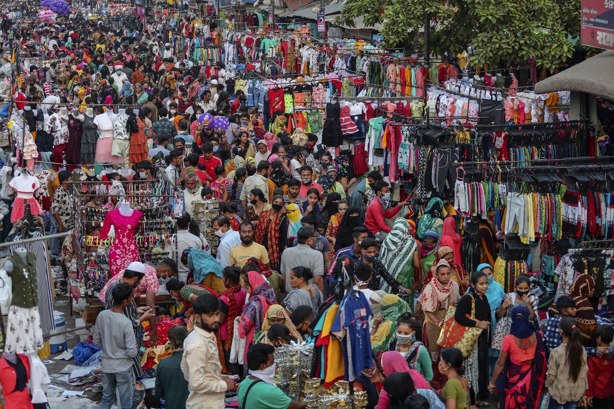Indians throng a market for shopping ahead of Hindu festival Diwali in Ahmedabad, India, Monday, Nov. 9, 2020. India's tally of coronavirus cases is currently the second largest in the world behi ...