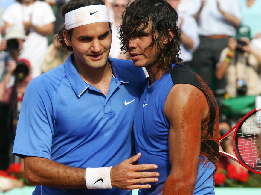 Spain&#039;s Rafael Nadal, right, gets a hug from Switzerland&#039;s Roger Federer after the men&#039;s final match during the French Open tennis tournament at the Roland Garros stadium in Paris, Sund ...