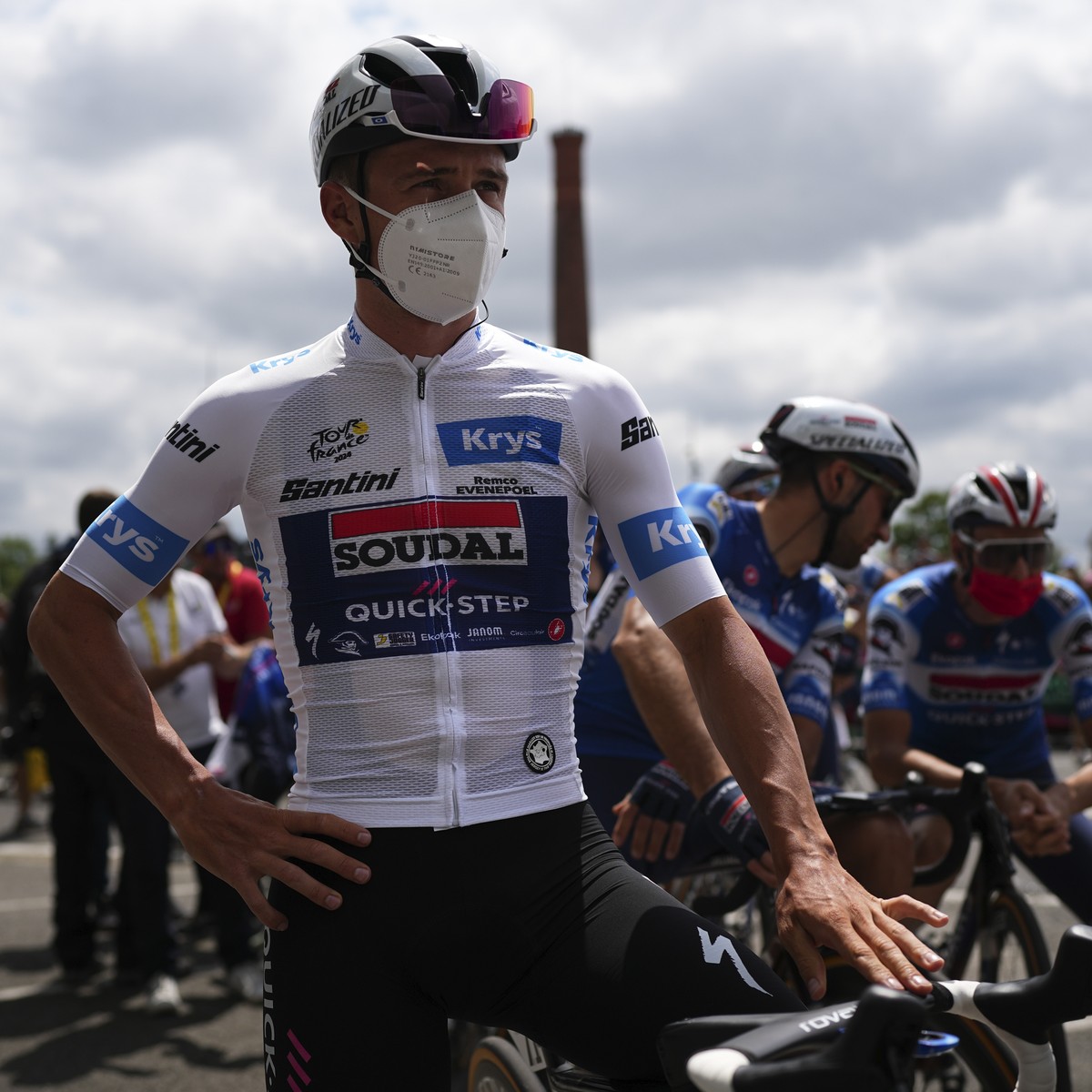 Belgium's Remco Evenepoel, wearing the best young rider's white jersey, wears a face mask to protect himself from the Corona virus prior to the start of the fourteenth stage of the Tour de F ...