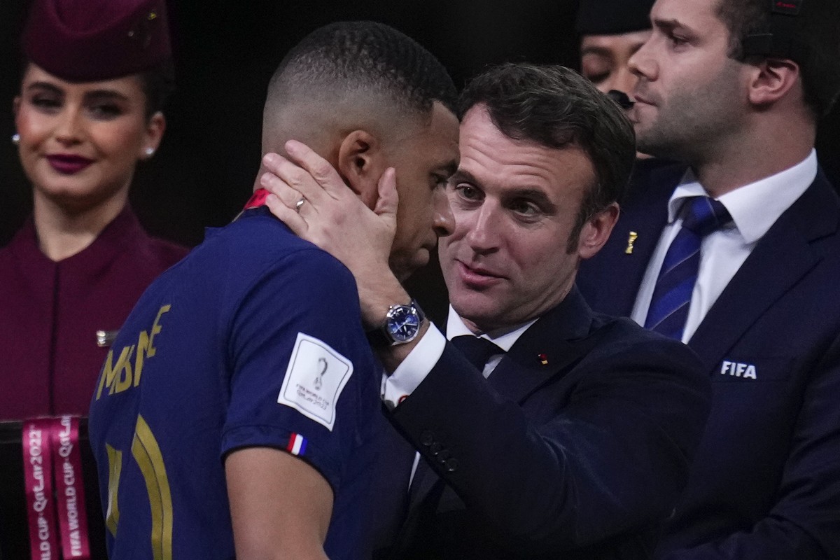 France's Kylian Mbappe is consoled by French President Emmanuel Macron after the World Cup final soccer match between Argentina and France at the Lusail Stadium in Lusail, Qatar, Sunday, Dec.18,  ...