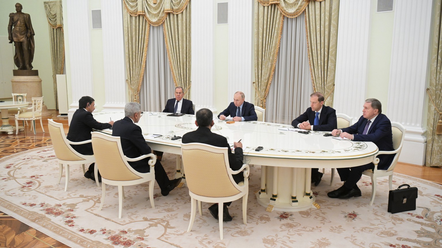 epa11045925 Russian President Vladimir Putin (back C) and Russian Foreign Minister Sergei Lavrov (back L) attend a meeting with Indian Minister for External Affairs Subrahmanyam Jaishankar (front C) i ...