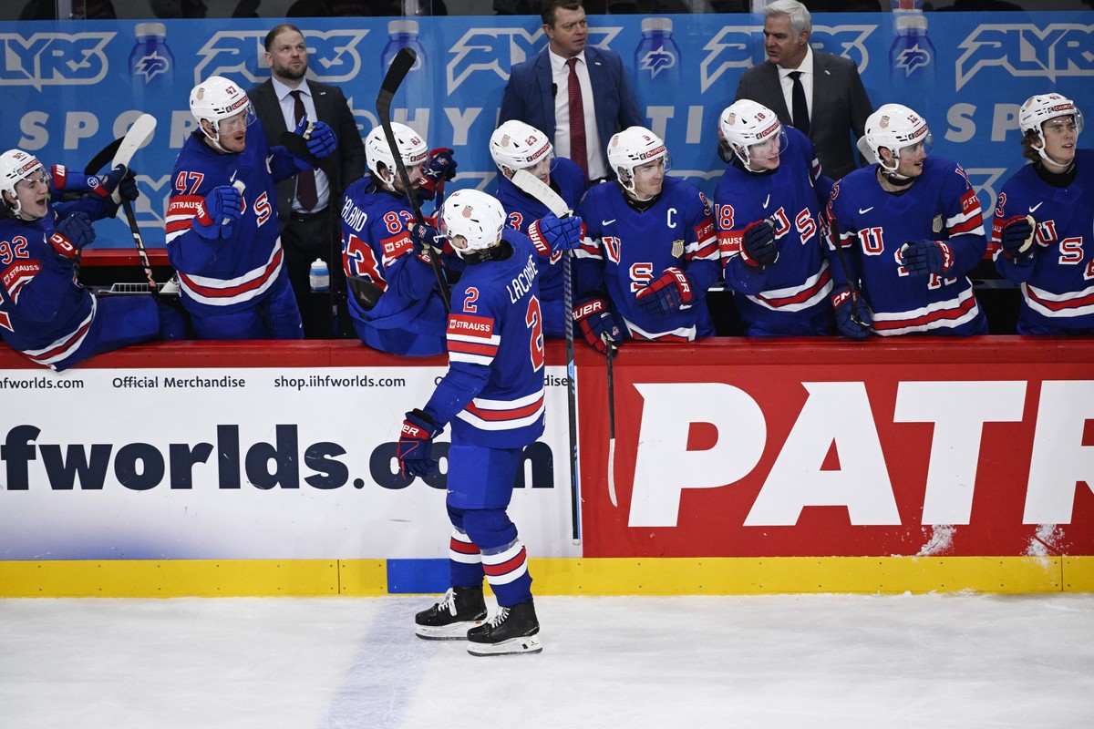 epa12130926 USA's Jackson LaCombe celebrates with teammates after scoring the 2-5 during the IIHF Ice Hockey World Championship semifinal match between Sweden and the USA at Avicii Arena in Stock ...