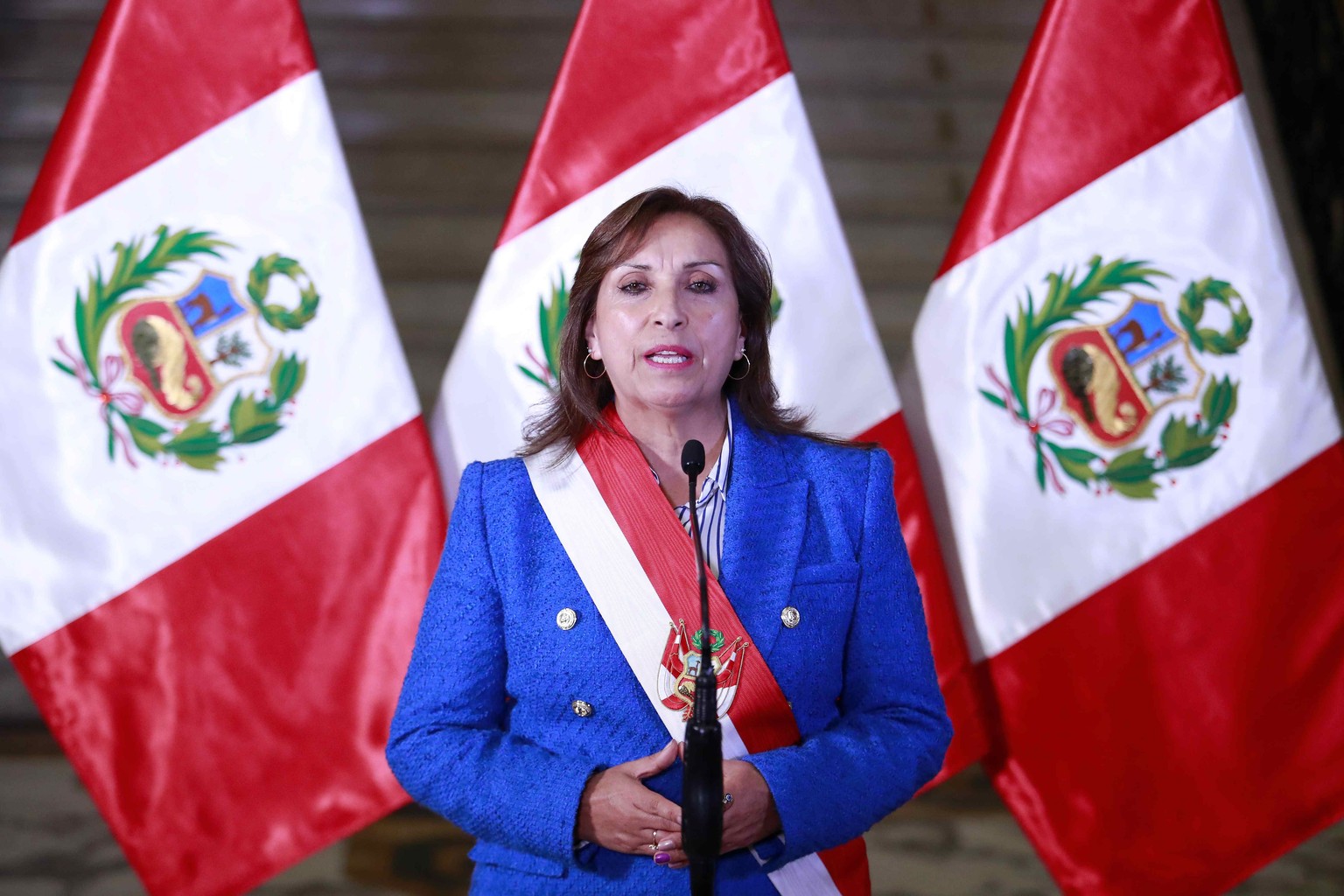 epa10361981 Handout photo made available by the Presidency of Peru of Peruvian President Dina Boluarte, proposing bringing general elections forward by two years to April 2024 amid ongoing political t ...