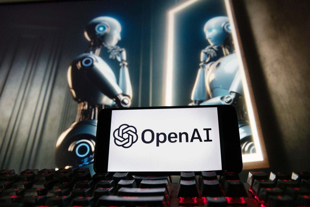 FILE - The OpenAI logo is displayed on a cellphone with an image on a computer monitor generated by ChatGPT's Dall-E text-to-image model, Dec. 8, 2023, in Boston. (AP Photo/Michael Dwyer, File)
A ...