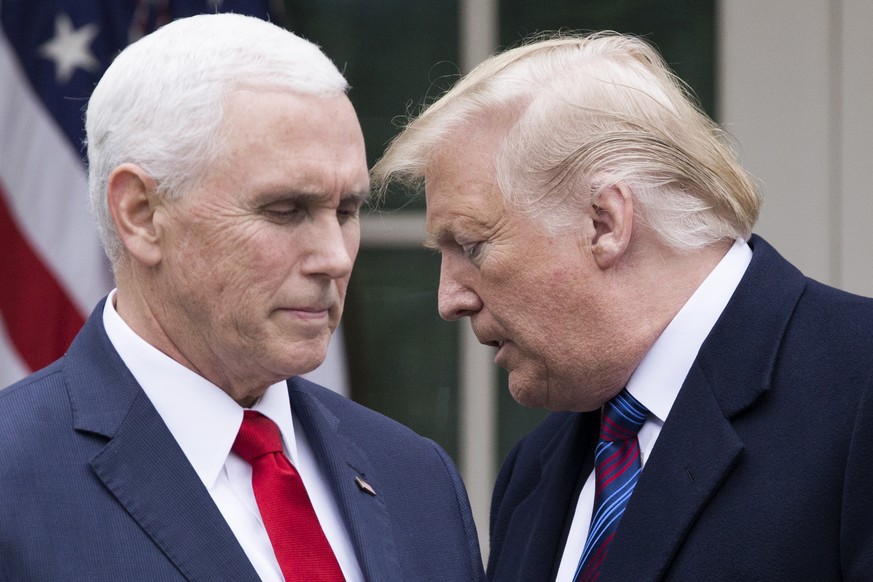 epa08931300 (FILE) - US President Donald J. Trump (R) turns over the podium to US Vice President Mike Pence (L) during a news conference in the Rose Garden of the White House in Washington, DC, USA, 0 ...