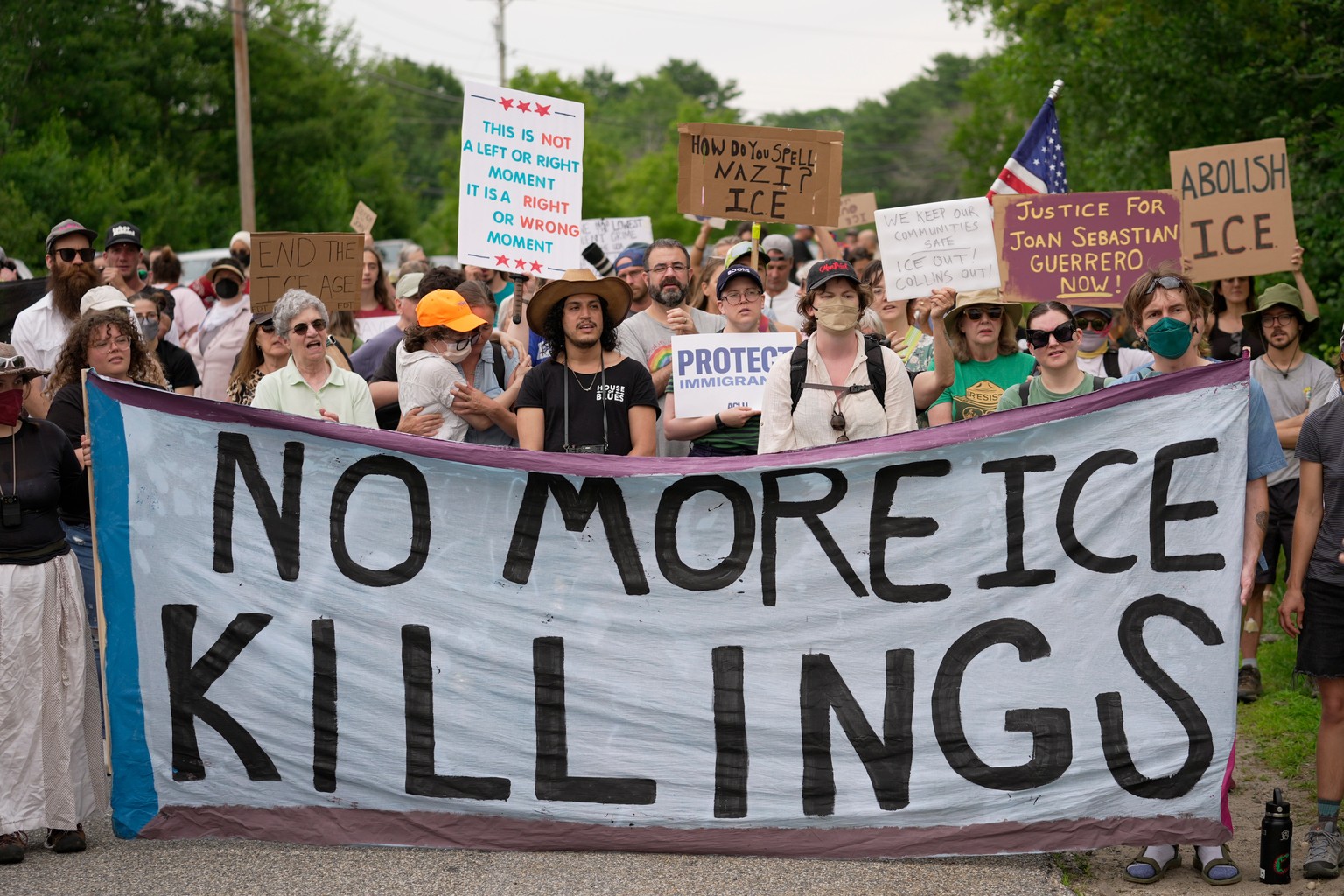 Protesters gather near a U.S. Immigration and Customs Enforcement facility Scarborough, Maine, one day after the shooting of Johan Sebastián Durán Guerrero, Tuesday, July 14, 2026. (AP Photo/Robert F. ...