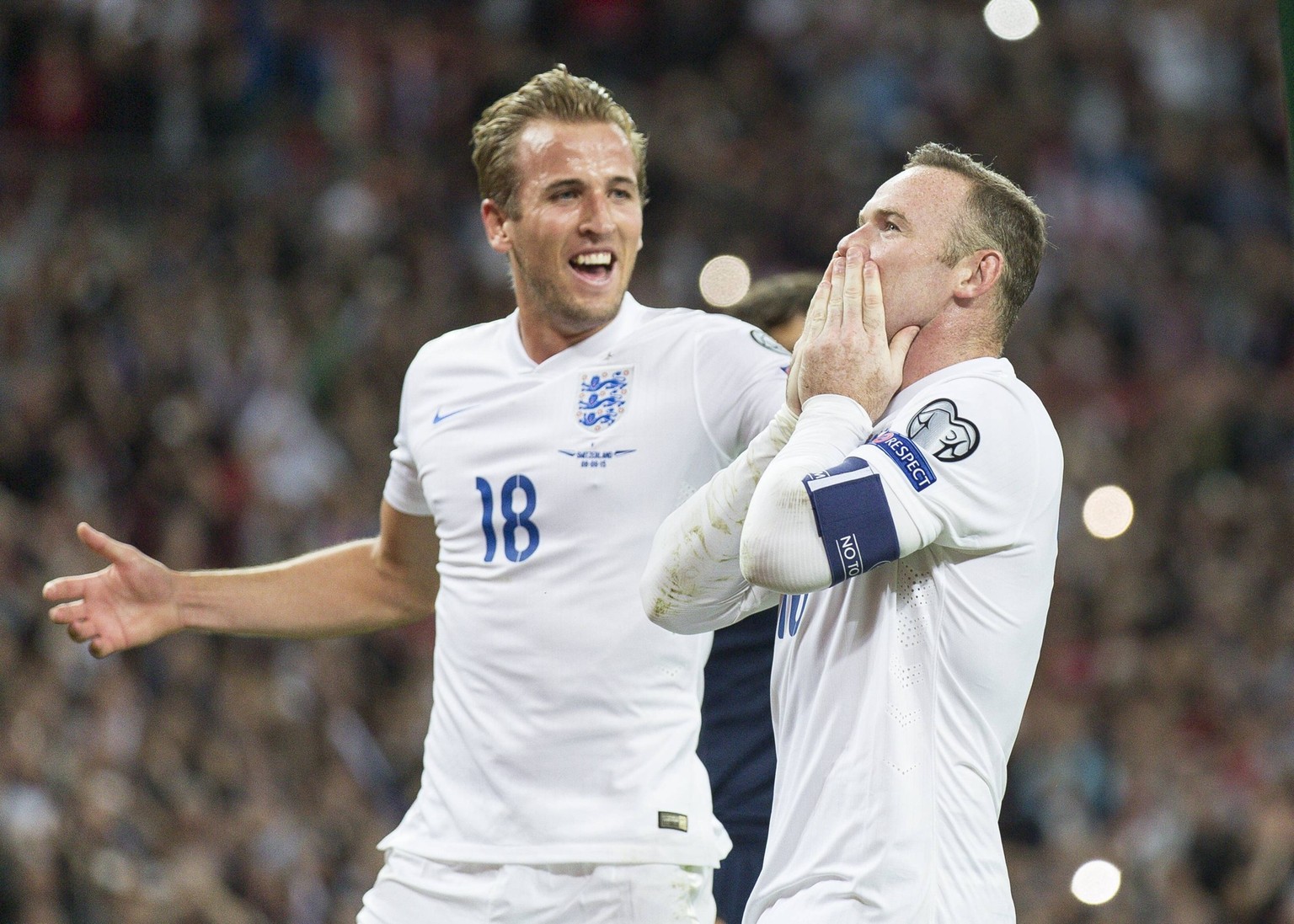 Football - 2015 / 2016 European Qualifier - Group E: England vs Switzerland. England s Harry Kane rushes in to congratulate team mate Wayne Rooney after he scored the goal that broke the England goals ...