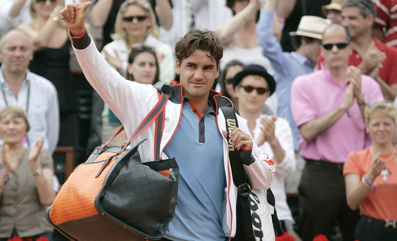 Switzerland&#039;s Roger Federer gestures after defeating Germany&#039;s Tommy Haas during their fourth round match of the French Open tennis tournament at the Roland Garros stadium in Paris, Monday J ...