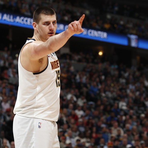 Denver Nuggets center Nikola Jokic points to a referee after Jokic was called for a foul during the second half of Game 5 of the team's NBA basketball second-round playoff series against the Port ...