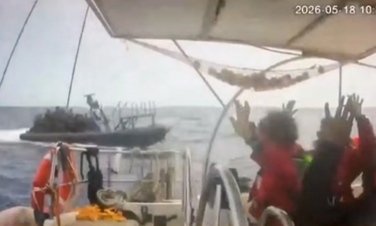 This grab from CCTV footage shows activists aboard a flotilla boat with their hands in the air as a boat approaches one of more than 50 vessels that departed from the port of Marmaris, Turkey, last we ...