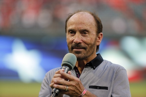 Country music artist Lee Greenwood sings &quot;God Bless the U.S.A.&quot; before a baseball game between the Los Angeles Angels and Texas Rangers on Wednesday, Sept. 21, 2016, in Arlington, Texas. (AP ...