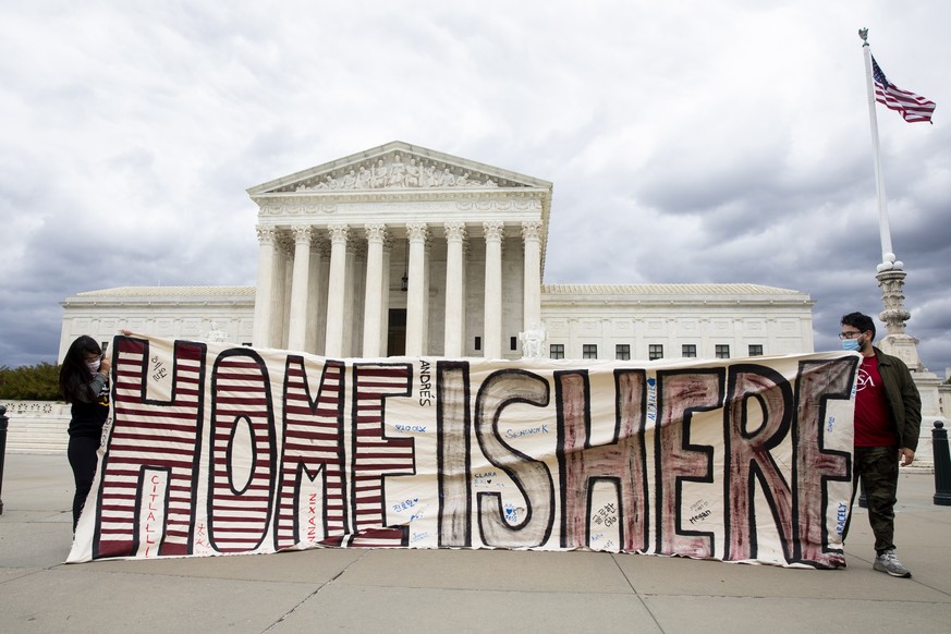 epaselect epa08388015 Participants hold a sign that reads &#039;Home is Here&#039; outside the US Supreme Court; as part of a demonstration held by immigration advocates and &#039;DREAMers&#039; drivi ...