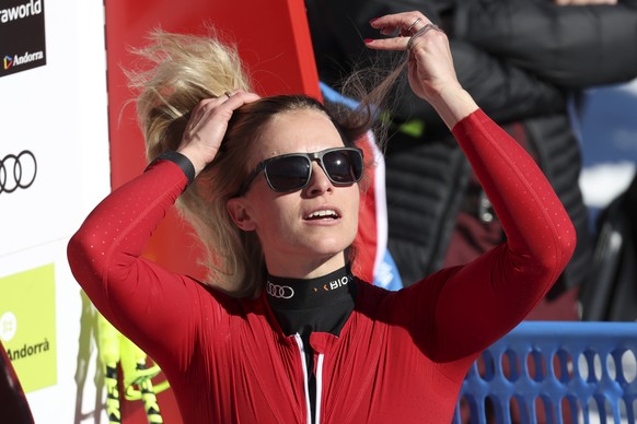 Switzerland&#039;s Lara Gut Behrami adjusts her hair at the finish area of an alpine ski, women&#039;s World Cup super-g race, in Soldeu, Andorra, Thursday, March 16, 2023. (AP Photo/Alessandro Trovat ...