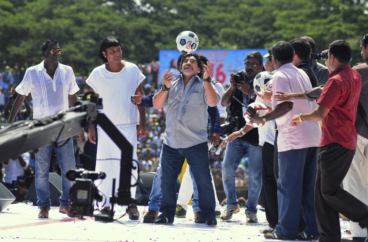 Argentine soccer legend Diego Maradona, center, entertains fans in Kannur, Kerala, India, Wednesday, Oct. 24, 2012. Maradona arrived on Tuesday in India's southern most state on a two-day private ...