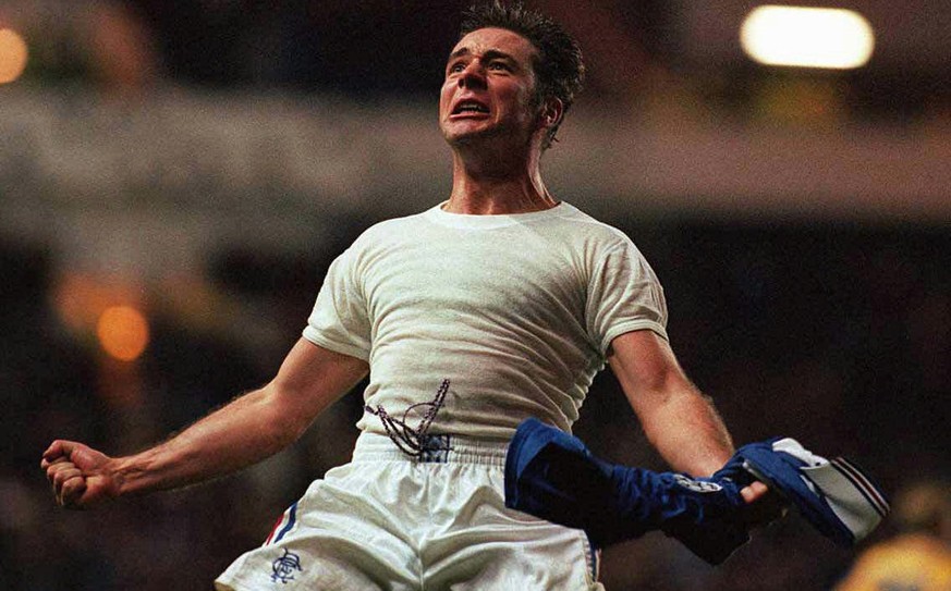 Glasgow Rangers Ally McCoist celebrates to the fans after he scored during his teams match against Grasshoppers Zurich, Wednesday night during the UEFA Champions League soccer match, Nov 20 1996. Rang ...