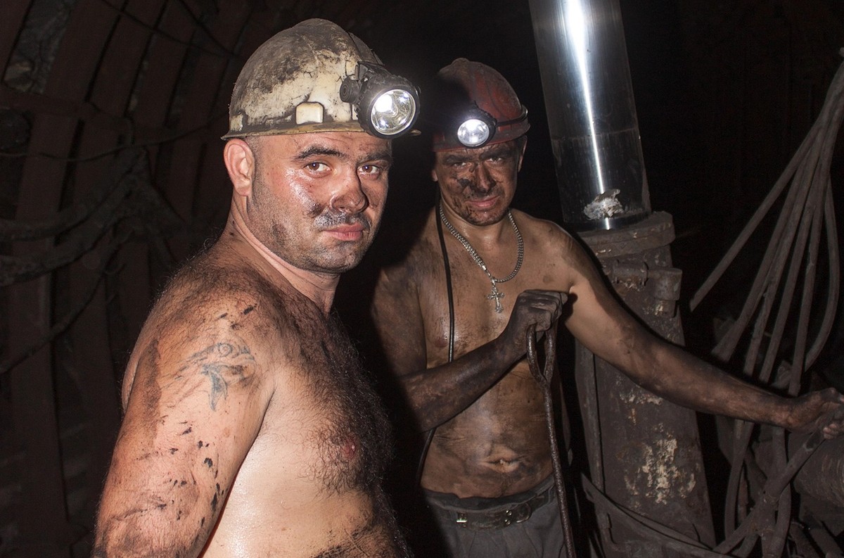 Novogrodovka, Ukraine - January, 18, 2013: The miners in the mine Novogrodovskaya at a depth of 800 meters below ground