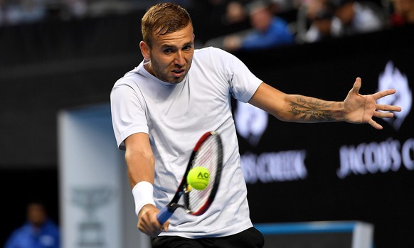 epa05733527 Daniel Evans of Great Britain in action against Bernard Tomic of Australia during their Men&#039;s Singles third round match for the Australian Open tennis tournament, in Melbourne, Austra ...