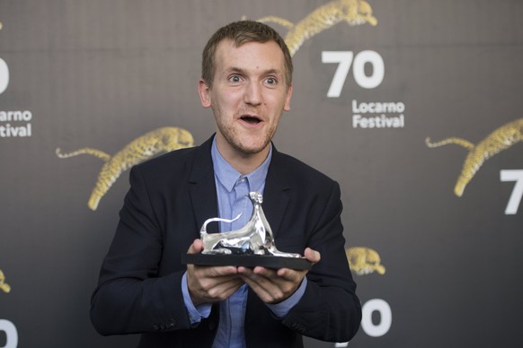 epa06139937 Actor Elliot Crosset Hove from Denmark poses during the photocall for the film &#039;Winter Brothers&#039; with the Pardo trophy for the best actor at the 70th Locarno International Film F ...