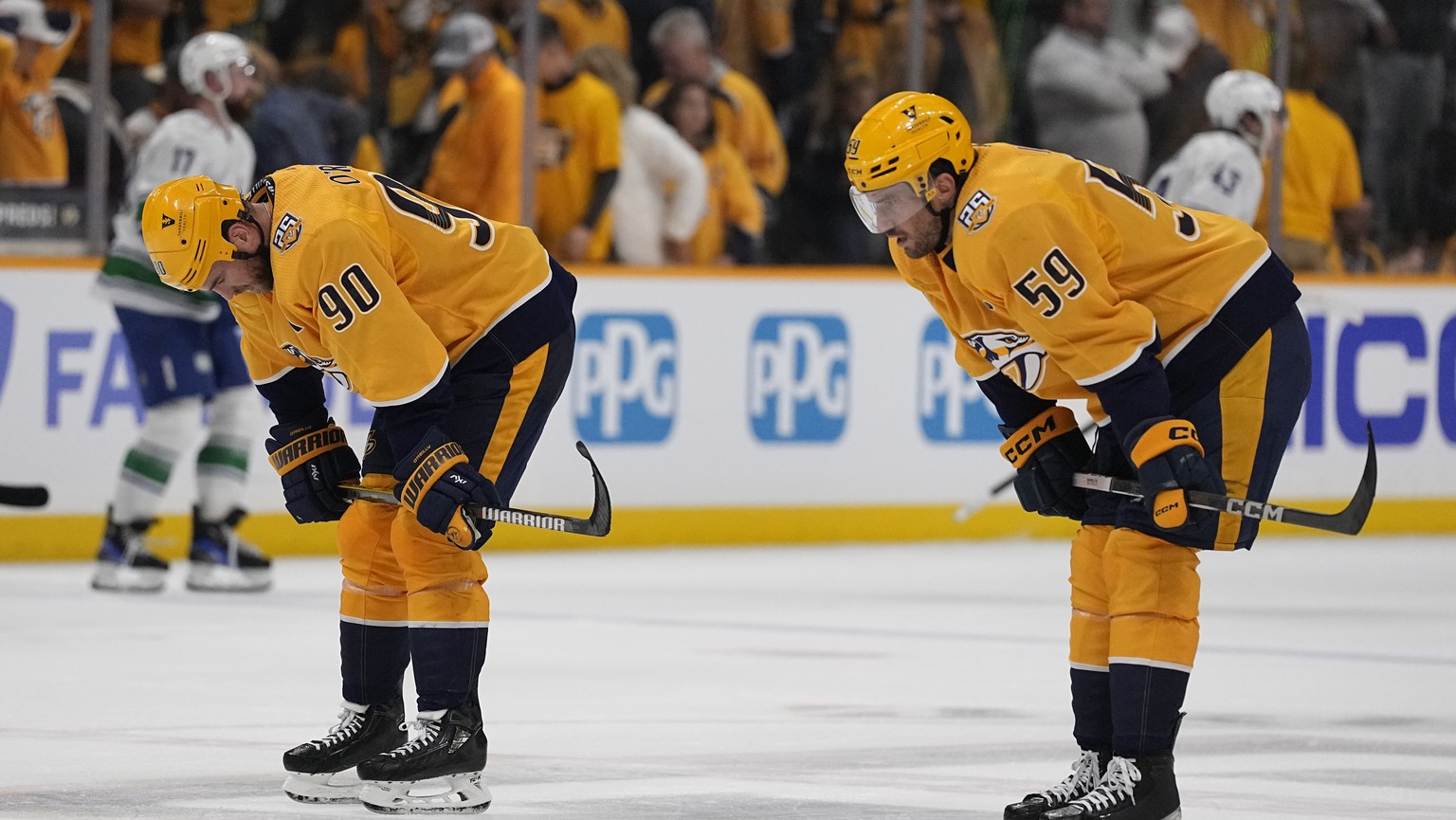 Nashville Predators center Ryan O&#039;Reilly (90) and defenseman Roman Josi (59) skate off the ice after the team 2-1 loss against the Vancouver Canucks in Game 3 of an NHL hockey Stanley Cup first-r ...