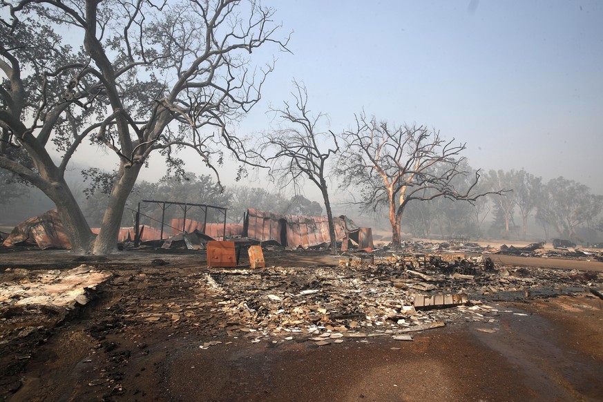 epa07156468 The ruins of The Western Town studio at Paramount Ranch that was destroyed by the Woosley Fire in Malibu, California, USA, 10 November 2018. Fires across California fueled by very dry cond ...