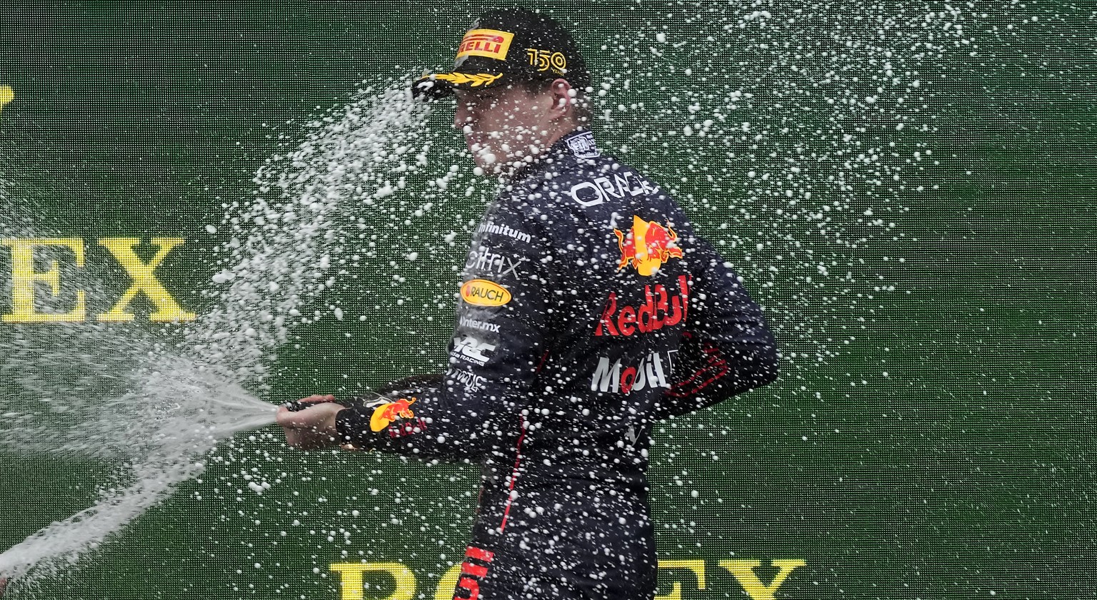 Red Bull driver Max Verstappen, of the Netherlands, celebrates on the podium after winning the Emilia Romagna Formula One Grand Prix, at the Enzo and Dino Ferrari racetrack, in Imola, Italy, Sunday, A ...